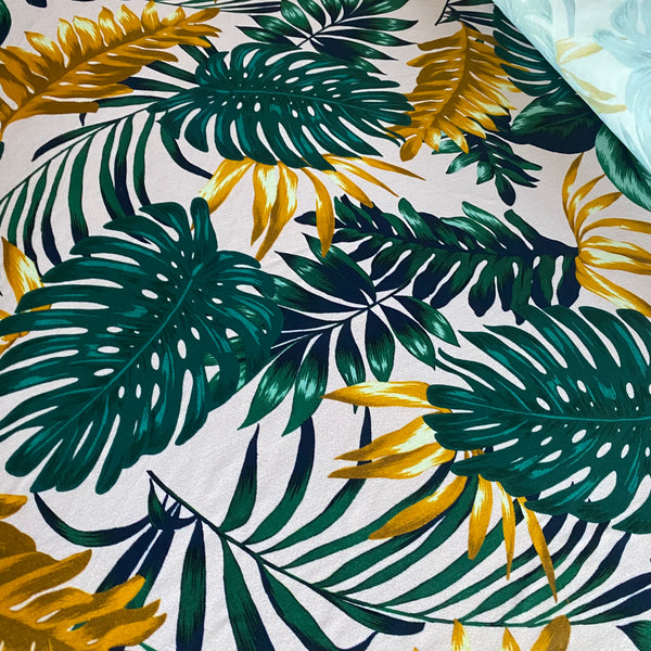 Green, Orange and Navy Fern Leaf print on Cream Tropical Lycra Fabric - 1m