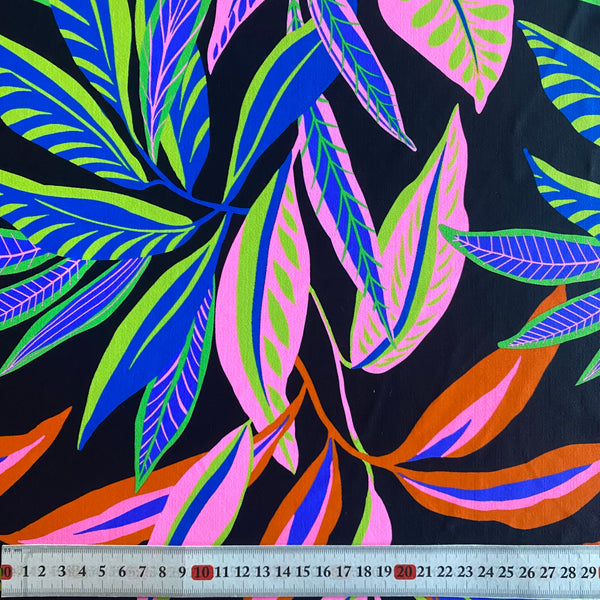 Green, Orange, Pink and Blue Leaf print on Black Tropical Lycra Fabric - 1m