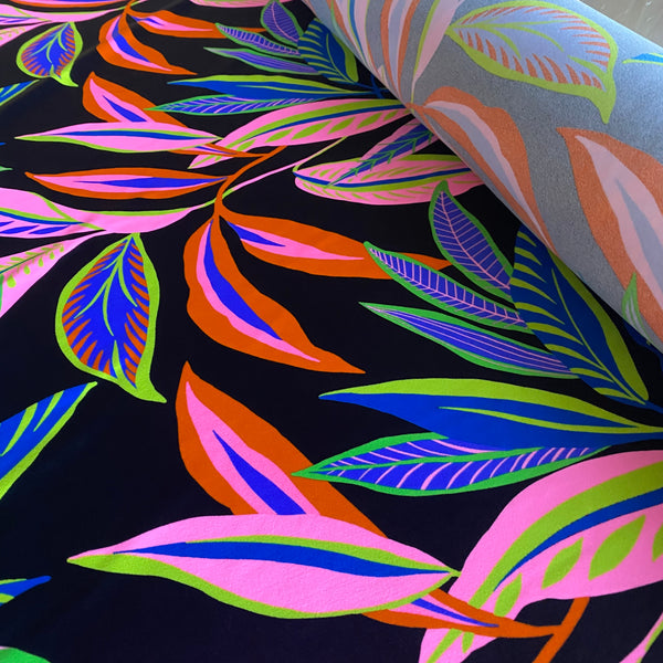 Green, Orange, Pink and Blue Leaf print on Black Tropical Lycra Fabric - 1m