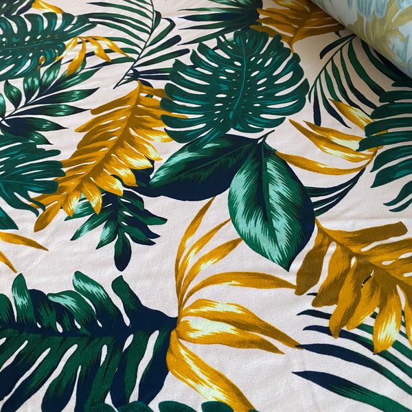 Green, Orange and Navy Fern Leaf print on Cream Tropical Lycra Fabric - 1m