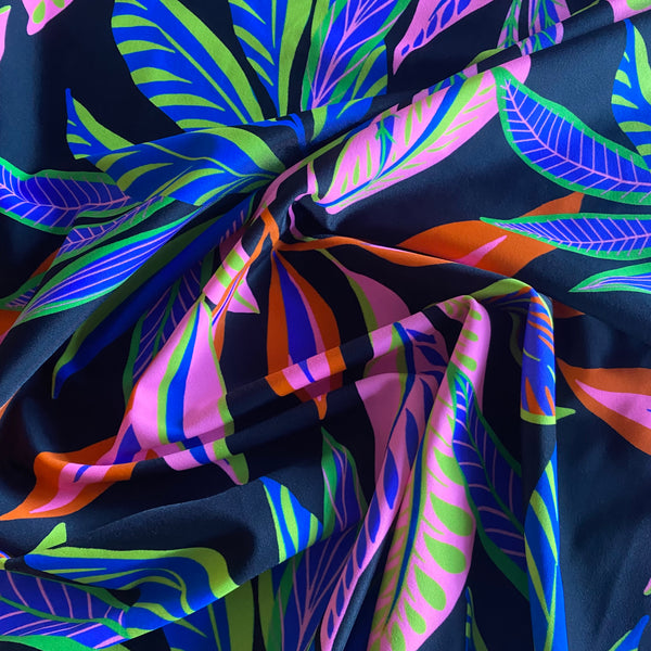 Green, Orange, Pink and Blue Leaf print on Black Tropical Lycra Fabric - 1m