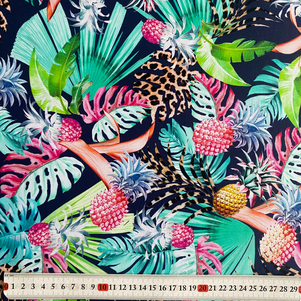 Tissu Lycra tropical imprimé feuilles de fougère vert, jaune, léopard, ananas et bleu marine - 1 m
