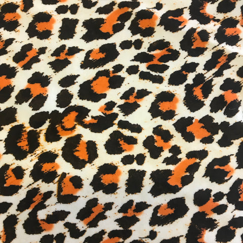 Stretch Black White & Orange Leopard Skin Animal Lycra Fabric 1m